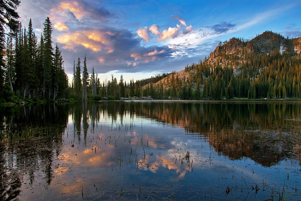 Sunrise reflected over a still lake, symbolizing quiet reflection